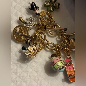 Juicy Couture Gold Charm Bracelet with 8 charms including 2008 limited editions